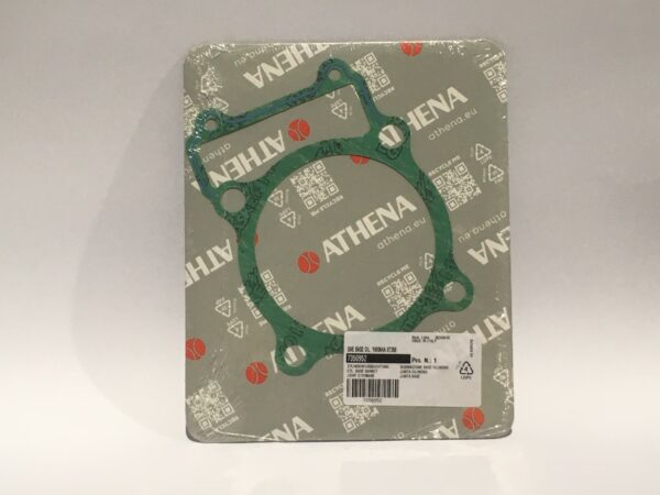 El empaque del kit de juntas de Athena destaca por el nombre y el logo de la marca. En su interior, encontrará una junta base verde y una etiqueta con código de barras que garantiza autenticidad y calidad para sus aplicaciones en "Junta base cilindro".