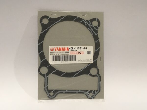 Base gasket for Yamaha motorcycle cylinders, part number 4DR-11351-00. Manufactured with high-quality gasket materials and presented in packaging with the manufacturer's label.