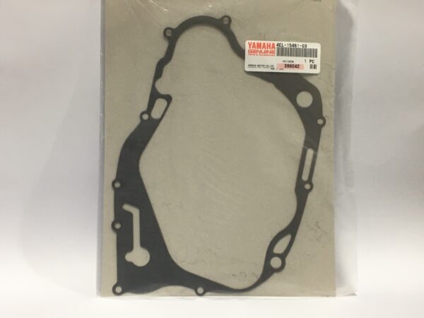 An image with a beige background shows a Yamaha engine gasket. The product details are highlighted, including specifications for the "Clutch cover gasket".