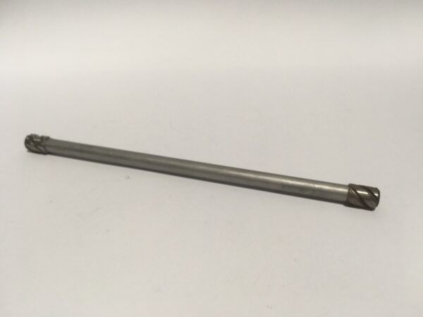 An elongated, cylindrical clutch rod with meticulously designed ends is positioned horizontally on a simple white background.
