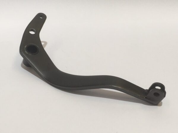 The rear brake pedal is a curved metal lever with three strategically placed holes, all on a white background.
